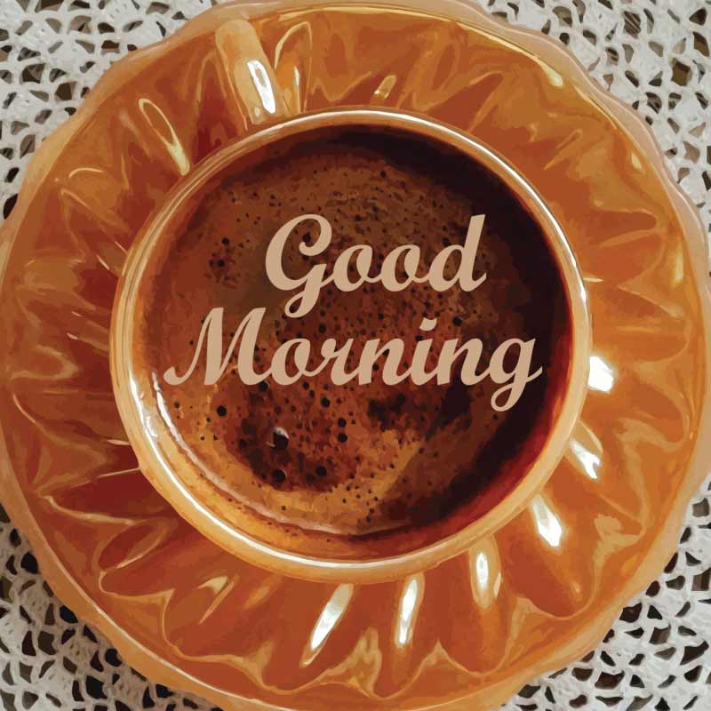 A brown cup filled with tea and a good morning greeting written on it